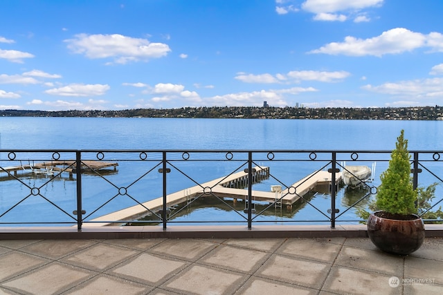 view of swimming pool featuring a water view