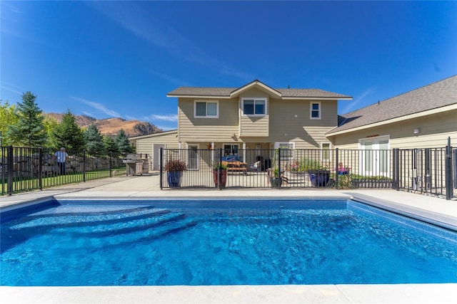 view of pool featuring fence and a patio