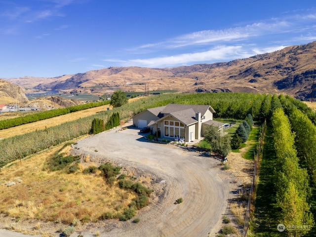 aerial view of sparsely populated area with a mountainous background