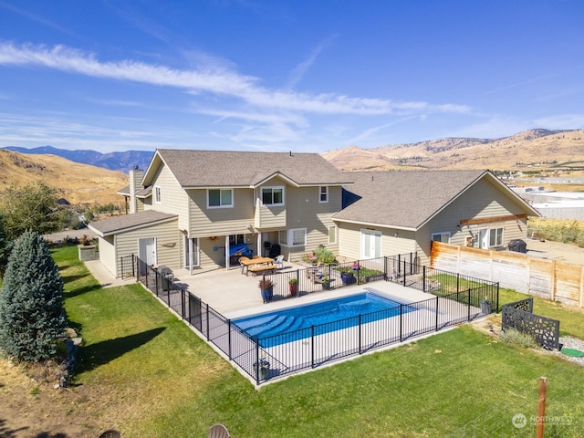 view of pool featuring a mountain view and a patio area