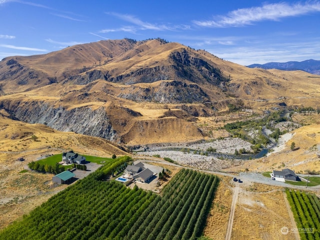 view of mountain background featuring rural landscape and farmland