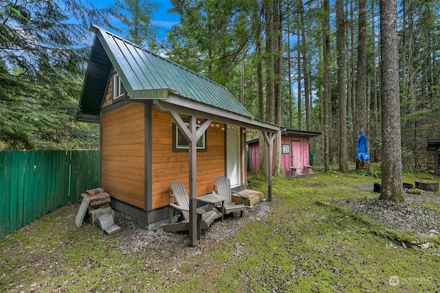 view of shed / structure featuring a lawn