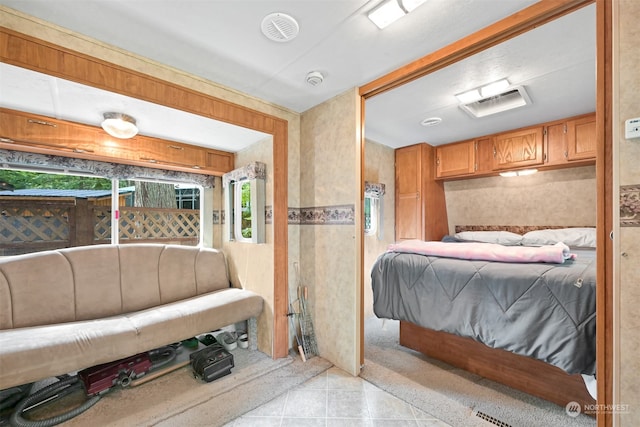 bedroom featuring light tile floors