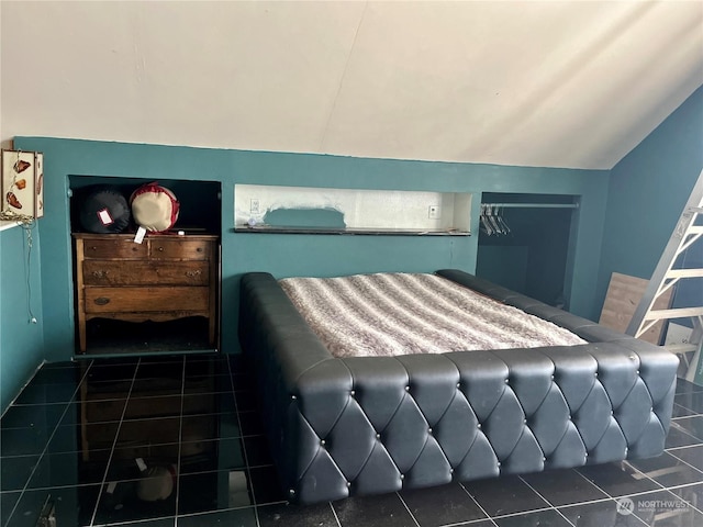 tiled bedroom with vaulted ceiling