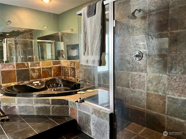 bathroom featuring decorative backsplash and shower with separate bathtub