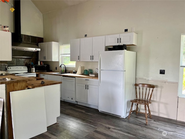 kitchen with white appliances, high vaulted ceiling, sink, and white cabinets