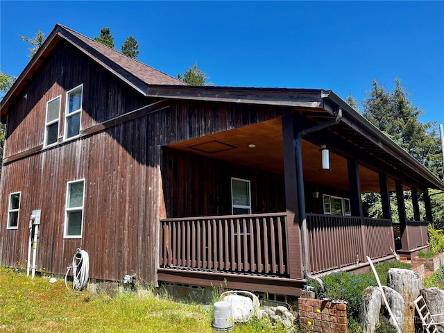 view of property exterior featuring covered porch