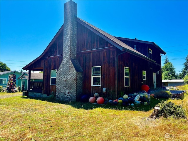 view of side of home featuring a yard