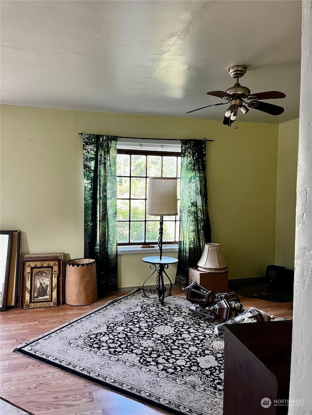 interior space featuring ceiling fan and hardwood / wood-style floors