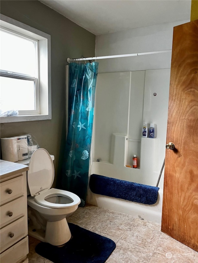 full bathroom featuring vanity, shower / bath combination with curtain, and toilet