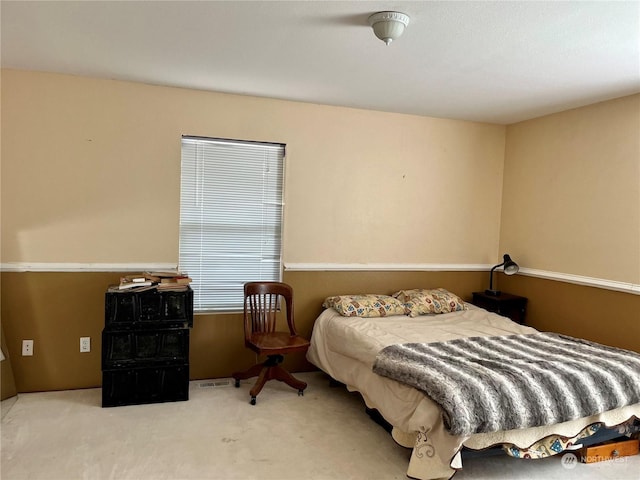 bedroom with light colored carpet