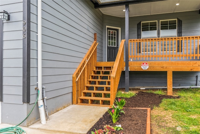 doorway to property featuring covered porch