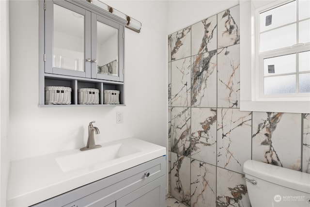 bathroom with vanity and toilet