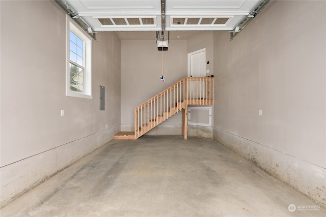 garage featuring a garage door opener and electric panel