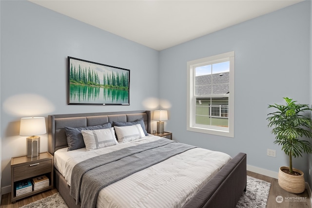 bedroom featuring wood-type flooring