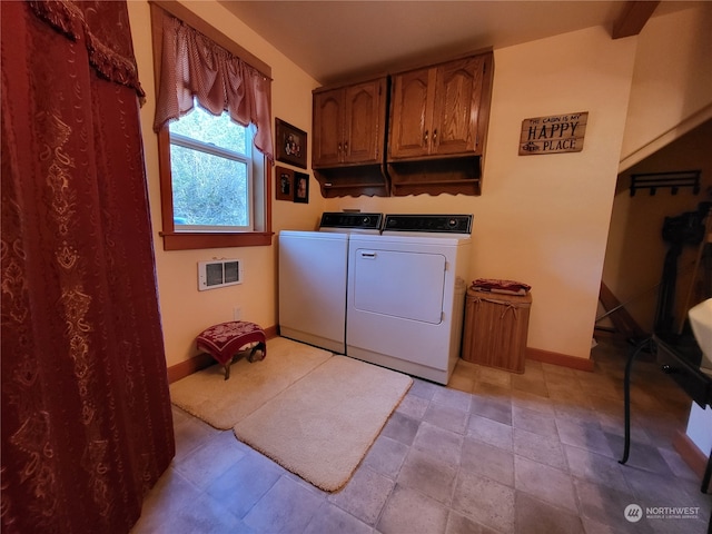 washroom featuring cabinets and separate washer and dryer