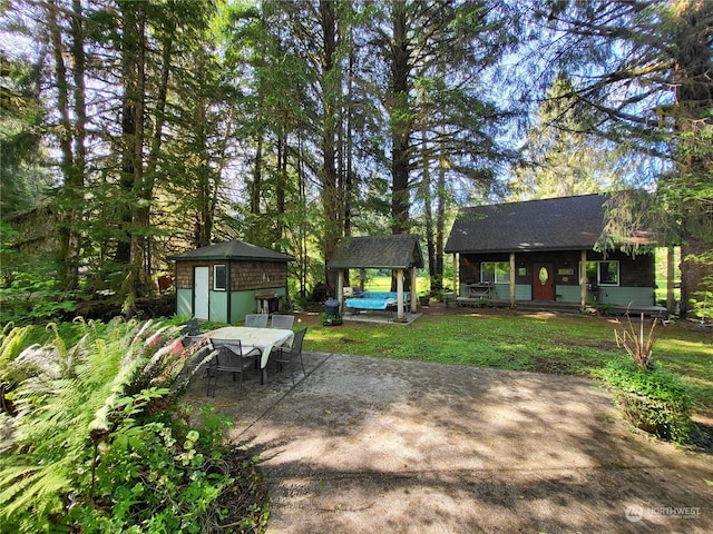 view of patio with a storage unit