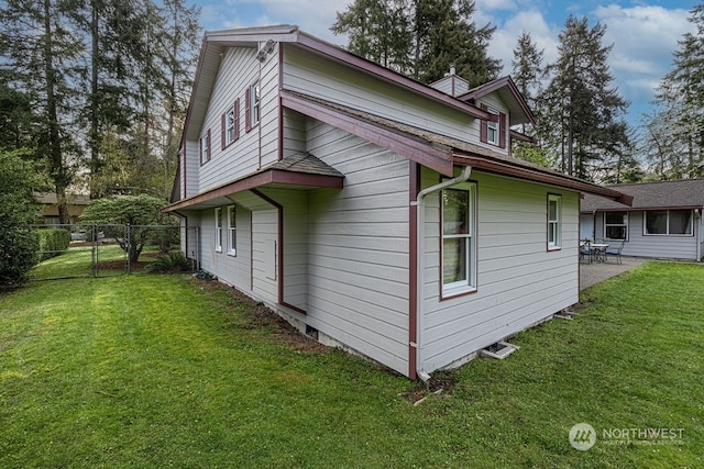 view of home's exterior with a lawn