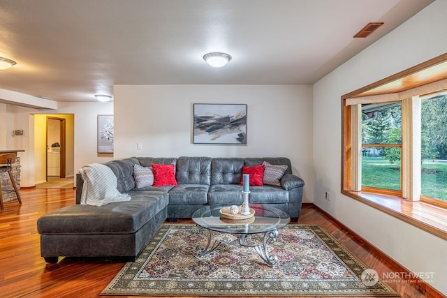 living room featuring dark wood-type flooring