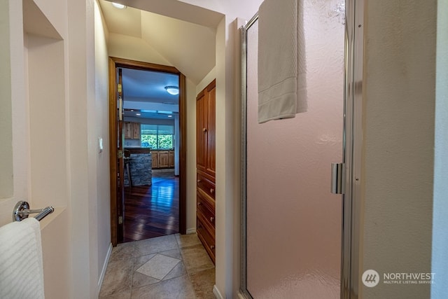 corridor with light tile floors