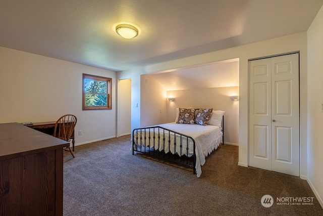 bedroom with dark carpet