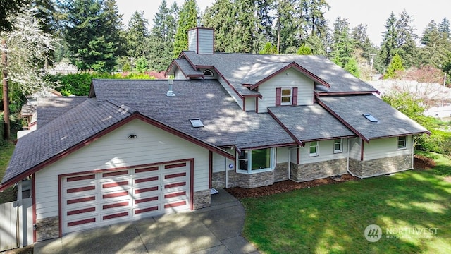 view of front of house with a front lawn and a garage