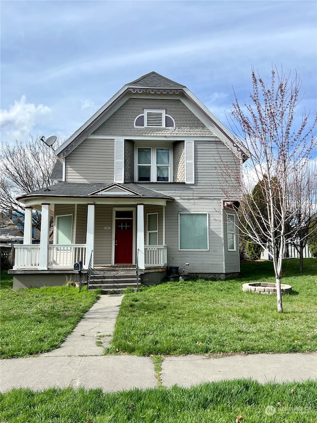 view of front of house featuring a front lawn and a porch