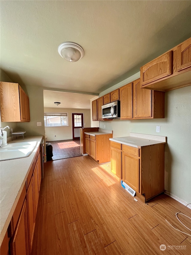 kitchen featuring light hardwood / wood-style floors and sink