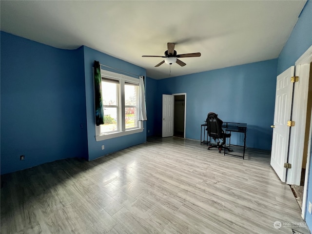 interior space featuring ceiling fan and light hardwood / wood-style flooring