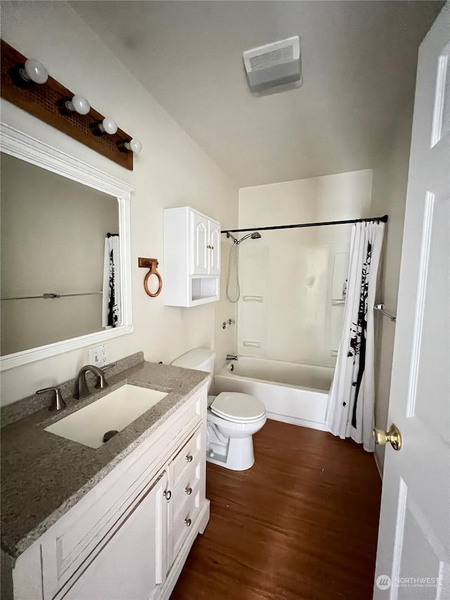 full bathroom featuring shower / tub combo, vanity, toilet, and hardwood / wood-style flooring