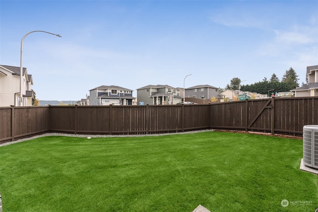 view of yard featuring central AC