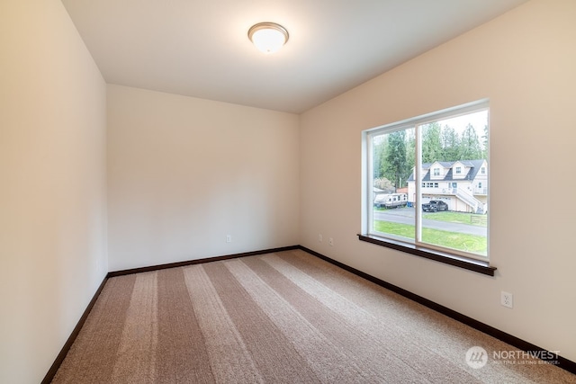 unfurnished room with carpet flooring