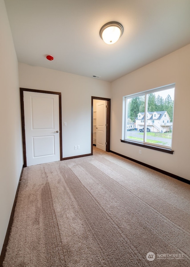 unfurnished bedroom featuring carpet floors