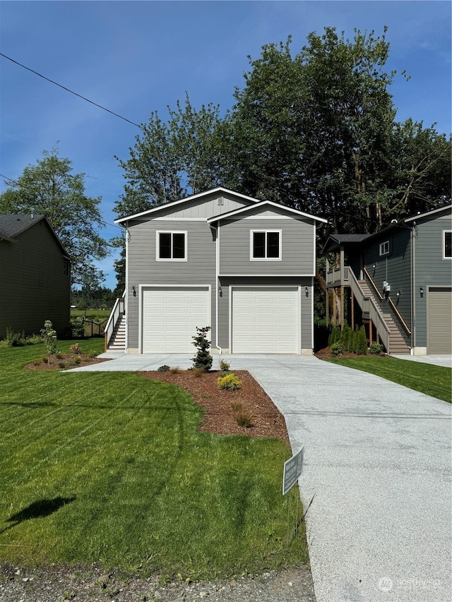 front of property with a garage and a front lawn