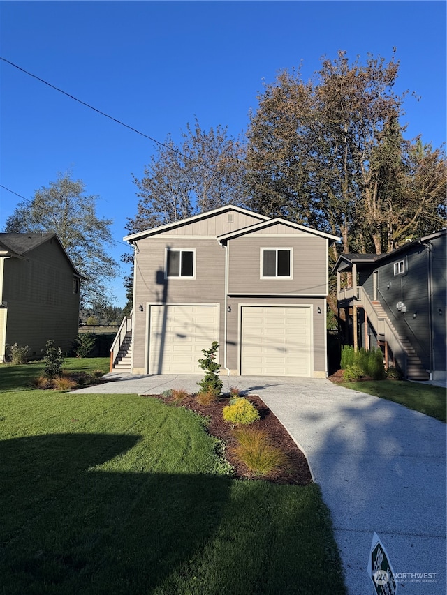 view of front of property featuring a garage and a front lawn