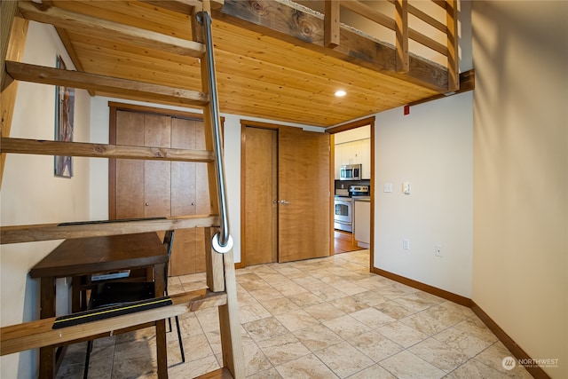 interior space featuring wooden ceiling and light tile floors