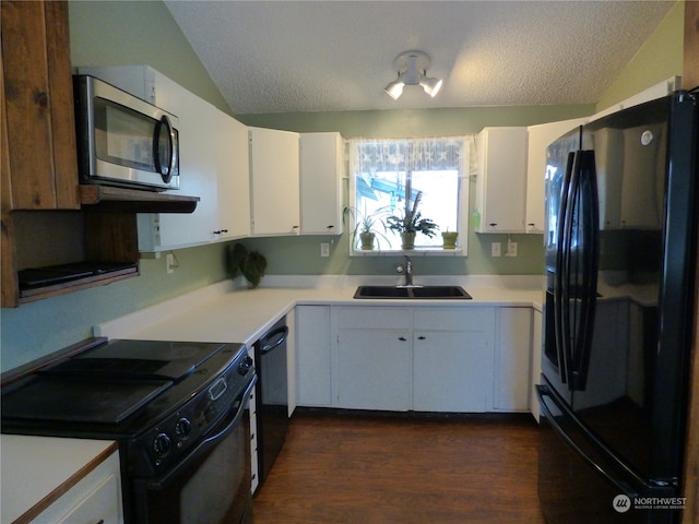 kitchen with black appliances, a textured ceiling, white cabinetry, and sink