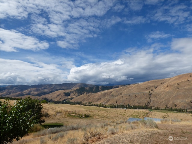 mountain view featuring a rural view