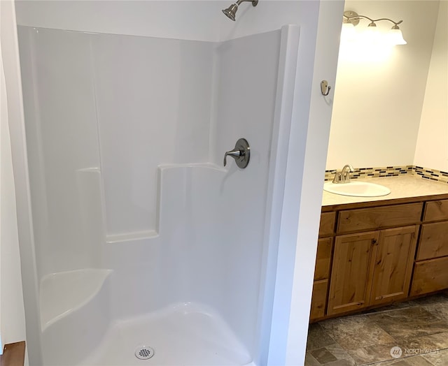 bathroom with tile flooring and vanity