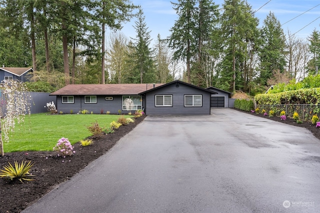 ranch-style home featuring a front yard