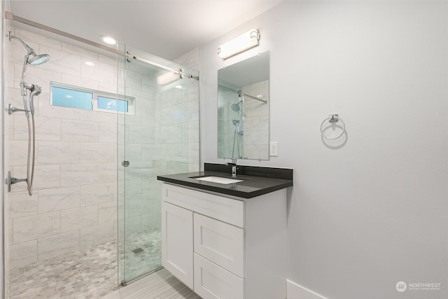 bathroom featuring oversized vanity and an enclosed shower