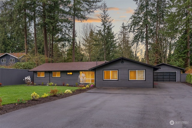 ranch-style home with a yard