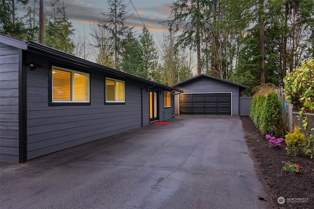 ranch-style house featuring a garage