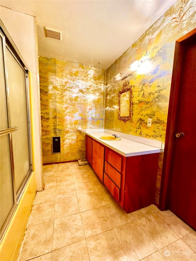 bathroom featuring tile floors and vanity