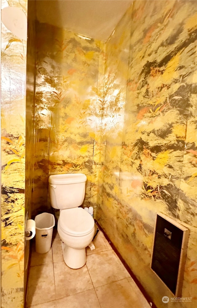 bathroom with tile flooring and toilet