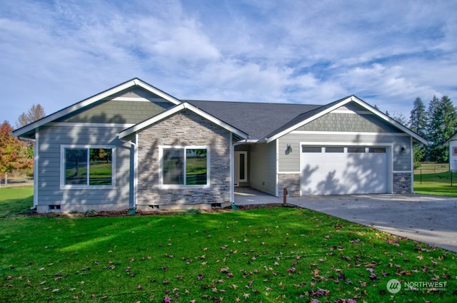 view of front of home with a front lawn and a garage