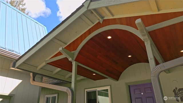 exterior details featuring beamed ceiling