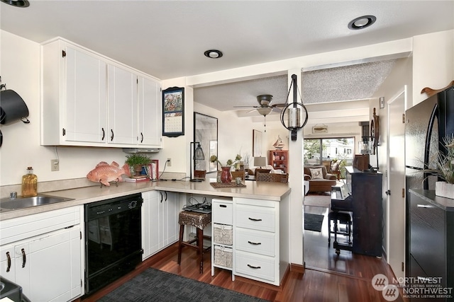 kitchen with white cabinets, dark hardwood / wood-style floors, ceiling fan, and black appliances