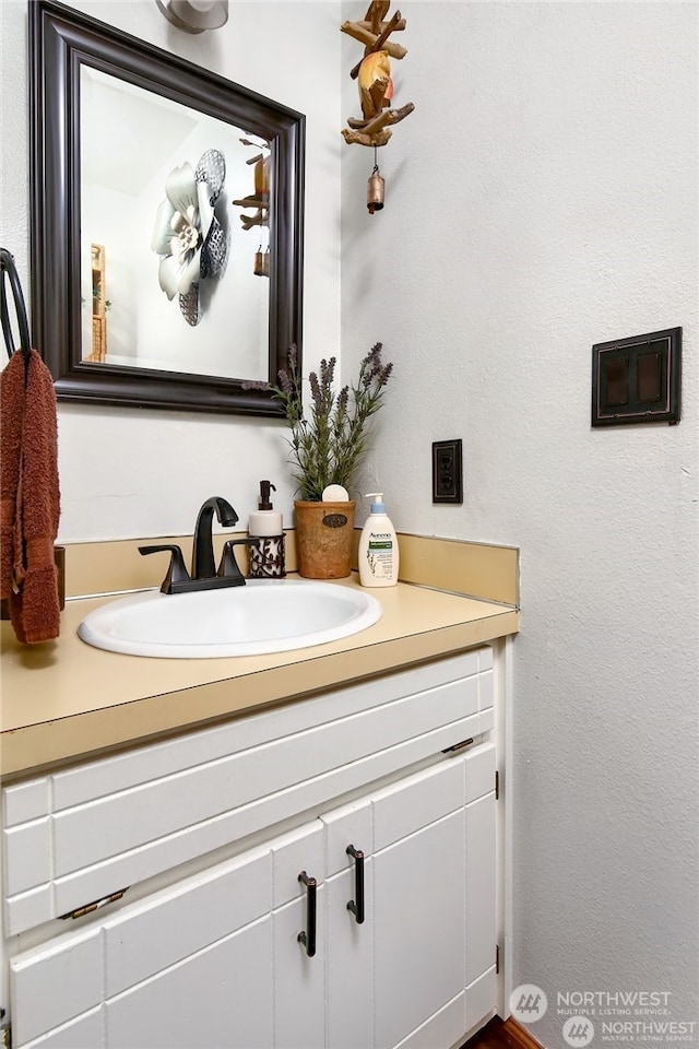 bathroom featuring large vanity