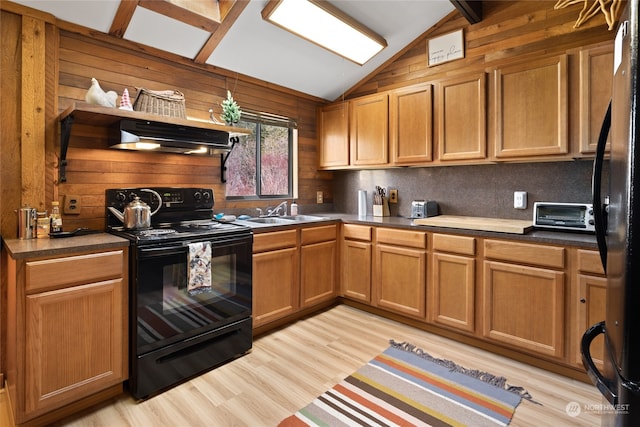 kitchen with vaulted ceiling with beams, light hardwood / wood-style flooring, black appliances, range hood, and sink